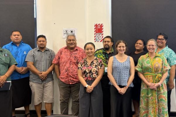 A group of 11 people standing together 